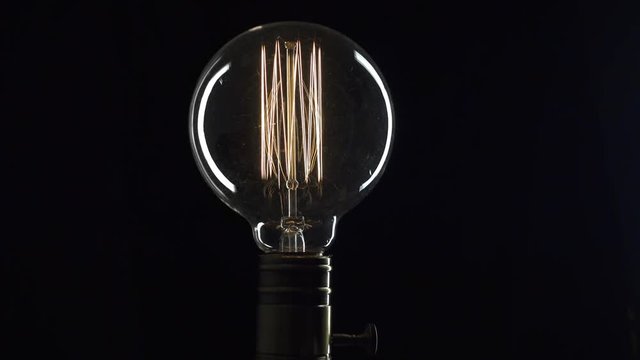 Edison's light bulb on black background