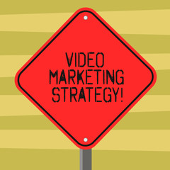 Text sign showing Video Marketing Strategy. Conceptual photo integrates engaging video into marketing campaigns Blank Diamond Shape Color Road Warning Signage with One Leg Stand photo