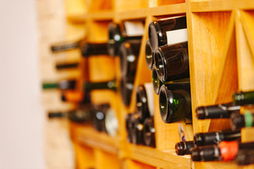 Wine cabinet with bottles and glasses. Daylight