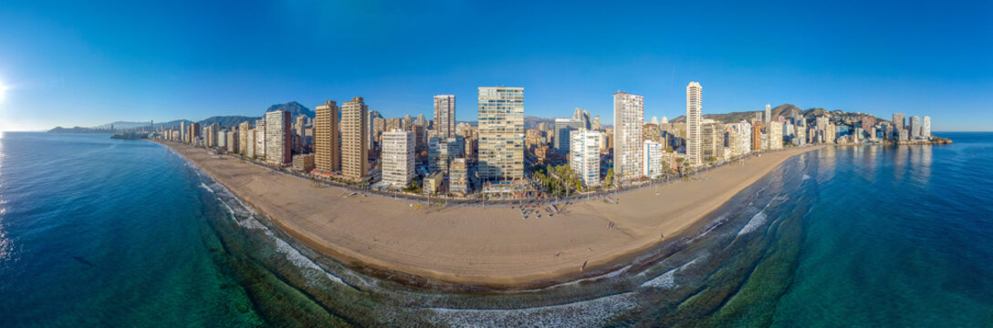 Extreme Wide Angle Photo Of The Beach And Coastal Front Of Benidorm In Alicante Showing Hotels, Restaurants, Bars And The Beautiful Beach.