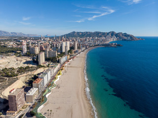 Fototapeta premium Aerial photo taken in Benidorm in Spain Alicante, showing the beautiful beach of Playa Levante and hotels, buildings, and high rise skyline cityscape.