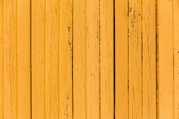 Fototapeta premium Texture of vertical wood panels, wall of old yellow boards, abstract background