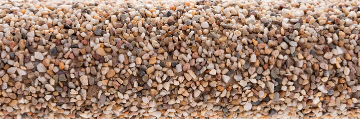 Small pebbles stones glued on the roll. Closeup