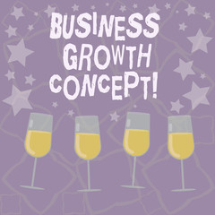 Writing note showing Business Growth Concept. Business photo showcasing process of improving some measure of success Filled Cocktail Wine Glasses with Scattered Stars as Confetti Stemware