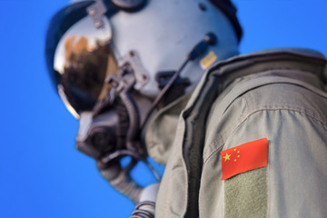 Air force pilot flight suit uniform with China flag patch. Military jet aircraft pilot	