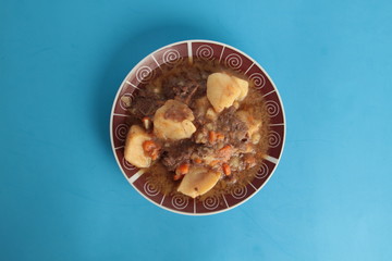 dish of stewed beef with potatoes and carrot