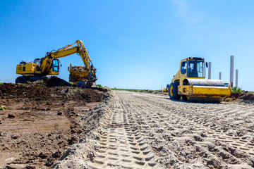 Trace of huge road roller with spikes to compact soil at construction site