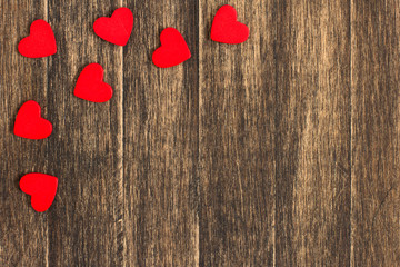Red  hearts on  wooden plank.Valentine's day background