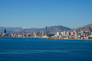 Aerial photo showing the whole of Benidorm in Alicante, you can see everywhere included Playa de Levante beach, Balcón del Mediterráneo and all the high rise hotels.