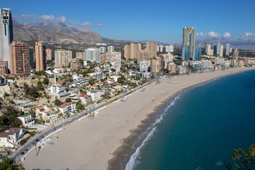Fototapeta na wymiar Aerial photo taken in Benidorm in Spain Alicante, showing the beautiful beach of Playa Levante and hotels, buildings, and high rise skyline cityscape.