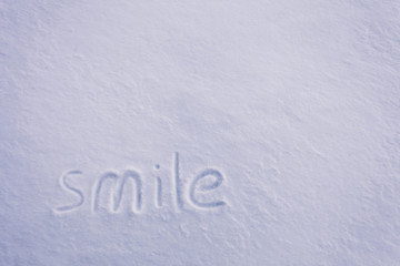 smile inscription in the snow