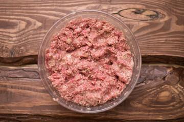 Fresh minced meat with bread for making meatballs.