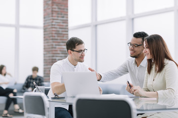 business team discussing online information at work meeting