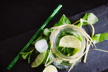 Mojito cocktail with lemon and mint.