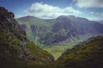 welsh mountains in snowdonia against clouds and blue sky