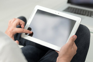 close up. digital tablet in the hands of a businessman