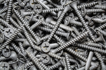 Texture. Background. Gray color. It is a lot of identical new nails of the average size. Construction materials. Repair.