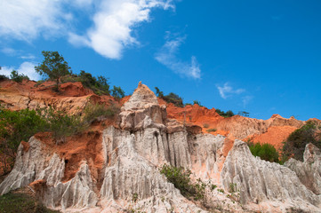 Naklejka premium Red sand Ham Tien canyon . Landscape with rocks . South Vietnam , Phan Thiet , Mui Ne