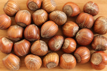 Hazelnuts on a wooden background