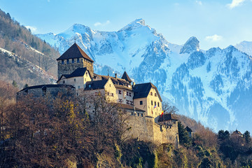 Vaduz Castle, Liechtenstein, with snow covered Alps mountains in background