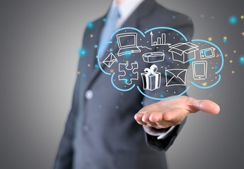 Man holding business elements icons on screen