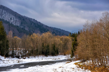 Beautiful winter landscape with a mountain river