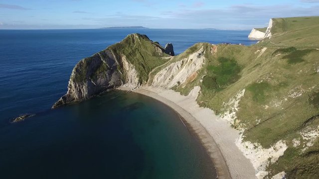 Slow Aerial Shot Over the Bay and Towards Durdle Door Cliff on the Jurassic Coast in Dorset