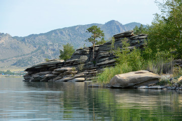 Summer landscape with lake and rocks