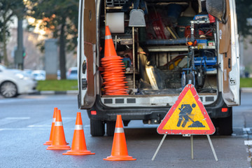 Valencia, Spain - January 16, 2019: Road maintenance van parked on a city street with cones.