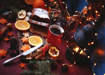 Fototapeta na wymiar Christmas and New year background with Pie and a mug of coffee on the cutting board,oranges,Tree decorations ,lantern, lights/top view/flat lay