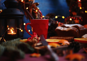 Christmas and New year background with Pie and a mug of coffee on the cutting board,oranges,Tree decorations ,lantern,  lights/top view/flat lay