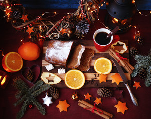Christmas and New year background with Pie and a mug of coffee on the cutting board,oranges,Tree decorations ,lantern,  lights/top view/flat lay