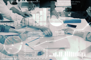 double exposure of abstract background of business meeting with hands on meeting table pointing and report and chart with overlay of digital chart concept of paperless working