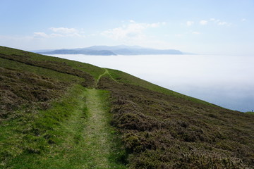 Naklejka premium welsh countryside with clouds and mountains