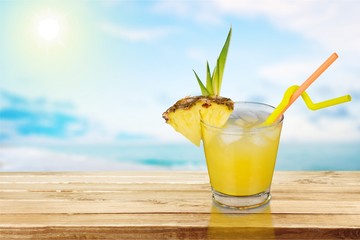 Lemonade with fresh lemon on  background