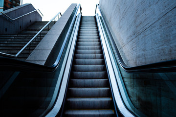 Escalator raising to the sky, concept image of arrival to success