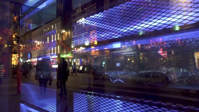Night Chinatown London Soho chinese restaurant window neon signboards reflection aquarium alive lobsters seafood.