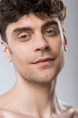 Obraz premium portrait of handsome young man isolated on grey