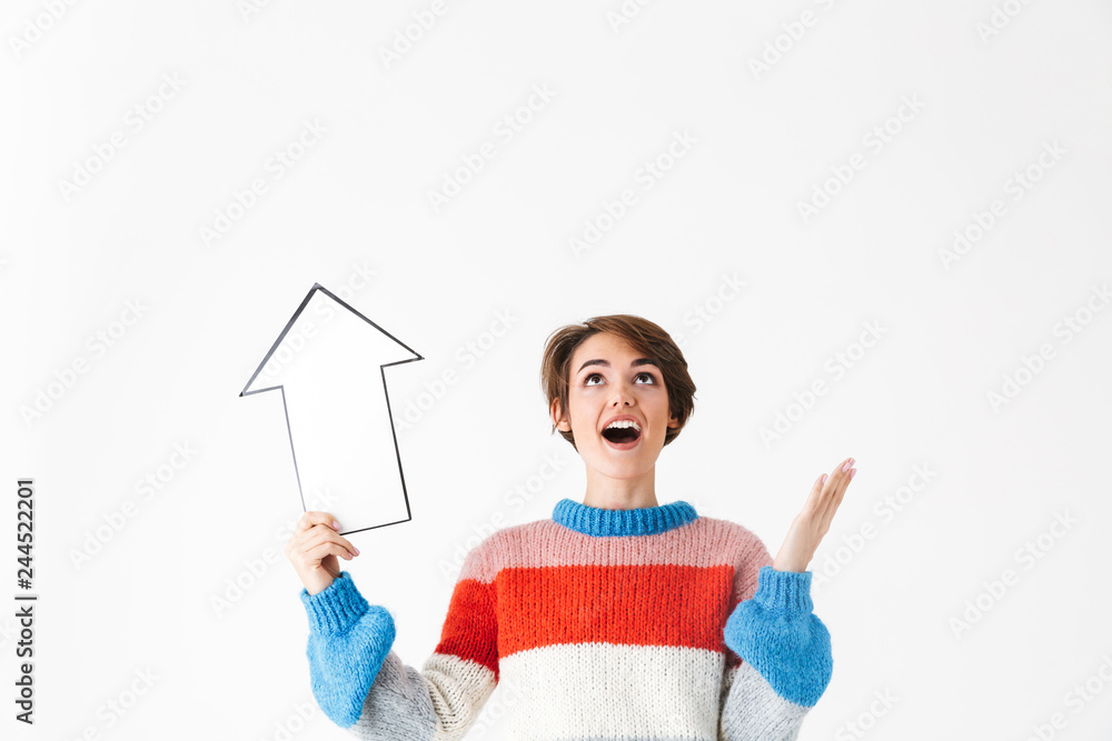 Wall mural Happy cheerful girl wearing sweater standing