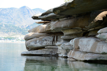 Summer landscape with lake and rocks
