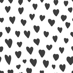 Fototapeta premium Cute seamless pattern with black hand drawn hearts. Monochrome lovely vector texture with doodle heart shapes for St. Valentines wrapping paper design, cover, surface, wallpaper, textile