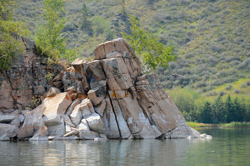 Summer landscape with lake and rocks