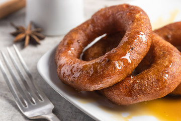 Peruvian classic dessert, picarones with honey