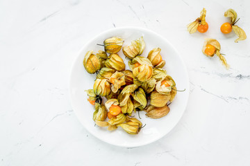 physalis on stone background top view mock up