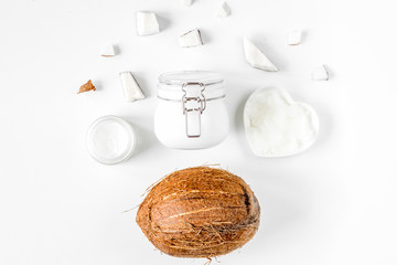 organic cosmetics with coconut on white background top view