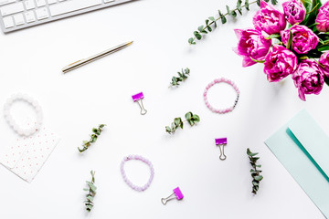 Woman office desk with flowers on white background top view