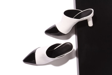 Black and white fashion mules