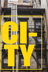 urban scene with old building in new york with yellow "city" lettering in frame, usa