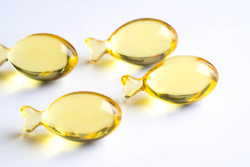 omega capsules on white fish shape