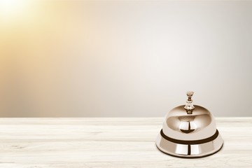 Reception service desk bell on light background